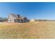 Exterior view of modern farmhouse with covered porch at 1434 Alcovy Station Rd, Covington, GA 30014