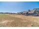 Home backyard with covered porch overlooking spacious lot and wooded view on a sunny day at 1452 Alcovy Station Rd, Covington, GA 30014