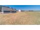 A new home with a long driveway and large, grassy back yard on a sunny day at 1452 Alcovy Station Rd, Covington, GA 30014