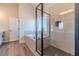 Elegant bathroom featuring a walk-in shower, soaking tub, and luxurious tile work at 1452 Alcovy Station Rd, Covington, GA 30014