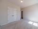 Bright bedroom featuring a carpeted floor with neutral colors and double closets at 1452 Alcovy Station Rd, Covington, GA 30014