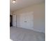 Cozy bedroom featuring double doors, soft carpeting, and neutral paint palette at 1452 Alcovy Station Rd, Covington, GA 30014