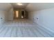 Large bonus room with neutral carpeting, recessed lighting, and convenient storage at 1452 Alcovy Station Rd, Covington, GA 30014