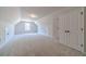 Expansive bonus room with neutral carpet, vaulted ceiling and storage nooks at 1452 Alcovy Station Rd, Covington, GA 30014