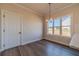 Charming dining area features hardwood floors, natural light, and modern chandelier at 1452 Alcovy Station Rd, Covington, GA 30014
