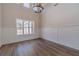 Sunlit dining room with stylish flooring and a modern chandelier at 1452 Alcovy Station Rd, Covington, GA 30014