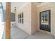 Inviting entryway with stylish brickwork and a sleek black front door at 1452 Alcovy Station Rd, Covington, GA 30014