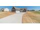 Well-designed house with a three-car garage and long drive on a spacious lot at 1452 Alcovy Station Rd, Covington, GA 30014