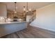 Open kitchen with stainless appliances, subway tile backsplash, and adjacent staircase at 1452 Alcovy Station Rd, Covington, GA 30014
