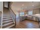 Kitchen next to staircase featuring an island and stainless steel appliances at 1452 Alcovy Station Rd, Covington, GA 30014