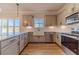 Kitchen with gray cabinets, stainless steel appliances, and wood floors at 1452 Alcovy Station Rd, Covington, GA 30014
