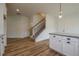 Kitchen and staircase featuring granite countertops, and stainless steel appliances at 1452 Alcovy Station Rd, Covington, GA 30014