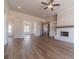 Spacious living room featuring a fireplace, wood floors, and a staircase at 1452 Alcovy Station Rd, Covington, GA 30014