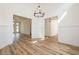 A large dining room and living room with dark hardwood floors at 1452 Alcovy Station Rd, Covington, GA 30014