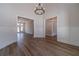 Elegant living room with hardwood floors, grand chandelier, and plenty of space at 1452 Alcovy Station Rd, Covington, GA 30014