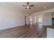 Bright living room featuring a ceiling fan and wood floors at 1452 Alcovy Station Rd, Covington, GA 30014