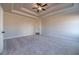 Inviting main bedroom with neutral carpet, tray ceilings, and natural lighting at 1452 Alcovy Station Rd, Covington, GA 30014