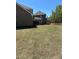 Backyard showcasing the newly sodded lawn of the brick home and covered patio at 5000 Fairview Cir, Villa Rica, GA 30180