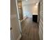 En-suite bathroom featuring a double vanity, separate tub and shower, and wood-look flooring at 5000 Fairview Cir, Villa Rica, GA 30180