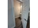 Stylish powder room featuring a pedestal sink, wood-look flooring, and neutral paint at 5000 Fairview Cir, Villa Rica, GA 30180