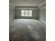 Bedroom with tray ceiling and large window overlooking the yard at 5000 Fairview Cir, Villa Rica, GA 30180
