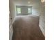 Bedroom with plush carpet, neutral walls, and windows offering natural light at 5000 Fairview Cir, Villa Rica, GA 30180