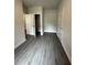 Cozy bedroom with closet and neutral walls with gray wood floors at 5000 Fairview Cir, Villa Rica, GA 30180