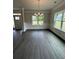 Bright dining room featuring large windows, natural light and modern chandelier at 5000 Fairview Cir, Villa Rica, GA 30180
