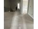 Hallway with neutral walls, iron railing staircase, and doorways, offering a bright, unfinished space at 5000 Fairview Cir, Villa Rica, GA 30180