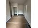 Hallway with dark flooring and multiple doorways at 5000 Fairview Cir, Villa Rica, GA 30180