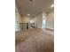 Upstairs hallway with iron railing and neutral carpet, providing a safe and stylish transition between rooms at 5000 Fairview Cir, Villa Rica, GA 30180
