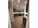 Modern kitchen with gray cabinets, granite countertops, and stainless steel appliances at 5000 Fairview Cir, Villa Rica, GA 30180