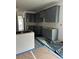 Kitchen features gray cabinets, and a view to the entryway at 5000 Fairview Cir, Villa Rica, GA 30180