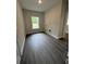 Functional laundry room with natural light and wood-look flooring at 5000 Fairview Cir, Villa Rica, GA 30180
