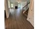 Open-concept living room features a fireplace and staircase with wood floors at 5000 Fairview Cir, Villa Rica, GA 30180