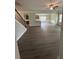 Open-concept living room featuring wood-look floors, ceiling fan, and great natural light at 5000 Fairview Cir, Villa Rica, GA 30180