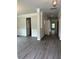 Open-concept living area with stylish gray wood flooring and classic white trim, perfect for entertaining at 5000 Fairview Cir, Villa Rica, GA 30180