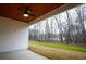 Covered back porch featuring a ceiling fan and a view of the backyard at 37 Harmony Ridge Dr, Temple, GA 30179