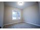 Neutral bedroom features a large window and plush carpet at 37 Harmony Ridge Dr, Temple, GA 30179