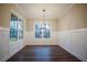 Dining room with hardwood floors and large windows showcasing views of the backyard at 37 Harmony Ridge Dr, Temple, GA 30179