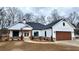 Charming farmhouse with stone accents, wood detailing, and a welcoming front porch at 37 Harmony Ridge Dr, Temple, GA 30179