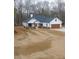 Attractive one-story home with white siding, wood accents, and freshly laid sod in the front yard at 37 Harmony Ridge Dr, Temple, GA 30179