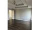 Large bedroom with dark gray laminate flooring and high ceilings at 6090 Kingston Ln, Mcdonough, GA 30253