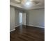 Bright bedroom featuring wood-look flooring and high ceilings at 6090 Kingston Ln, Mcdonough, GA 30253