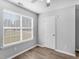 Well-lit bedroom featuring wood-look floors and a closet at 6090 Kingston Ln, Mcdonough, GA 30253