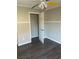 Bedroom with ceiling fan, closet, and wood-look floors at 6090 Kingston Ln, Mcdonough, GA 30253