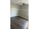 Bright bedroom with ceiling fan and wood-look floors at 6090 Kingston Ln, Mcdonough, GA 30253