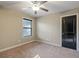 Spacious bedroom with neutral walls, carpeting, and ceiling fan at 7042 Confederate Ct, Villa Rica, GA 30116