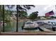 Community boat dock with many boats and American flag at 7042 Confederate Ct, Villa Rica, GA 30116