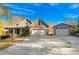 House exterior showing a two-story home with a three-car garage and landscaped yard at 7042 Confederate Ct, Villa Rica, GA 30116